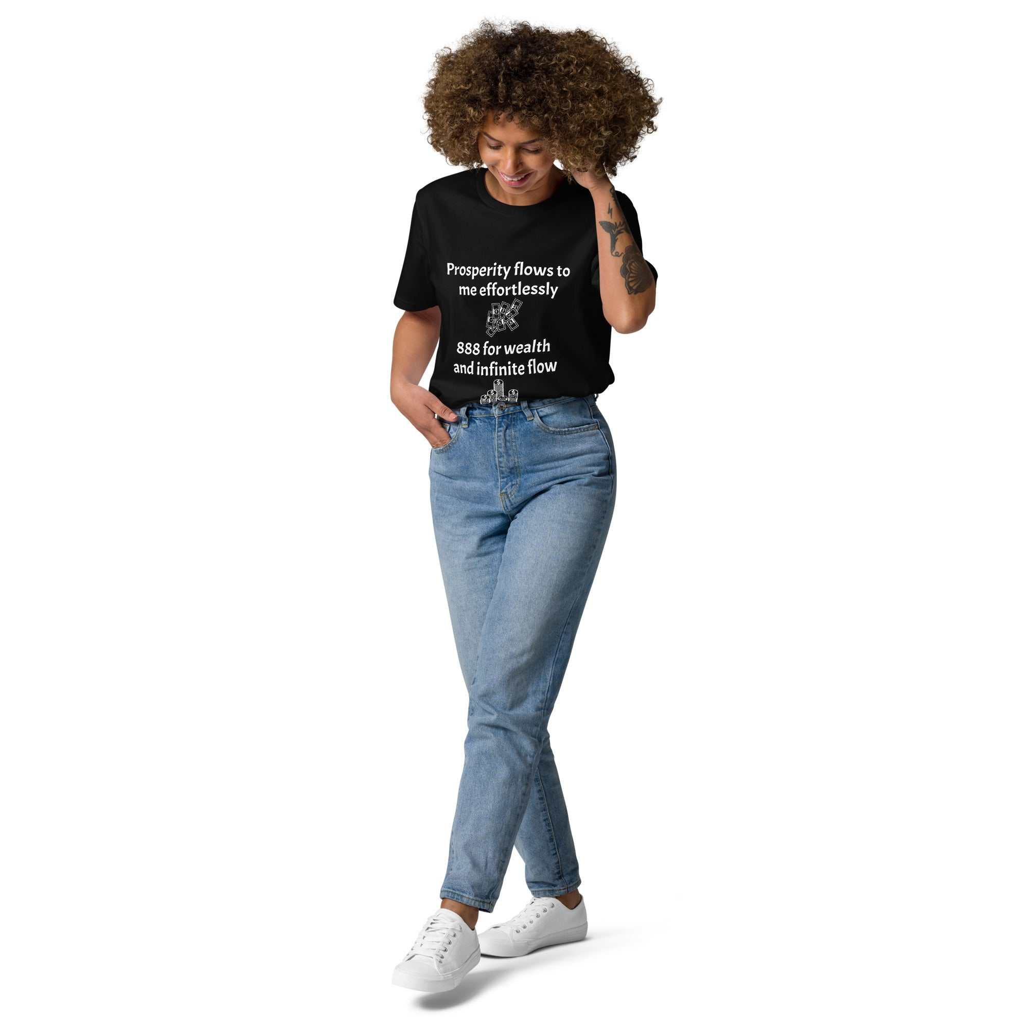 Woman wearing black unisex organic cotton t-shirt with printed positive message paired with blue jeans and white sneakers